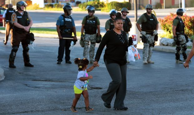 Police clear streets before sundown in Ferguson
